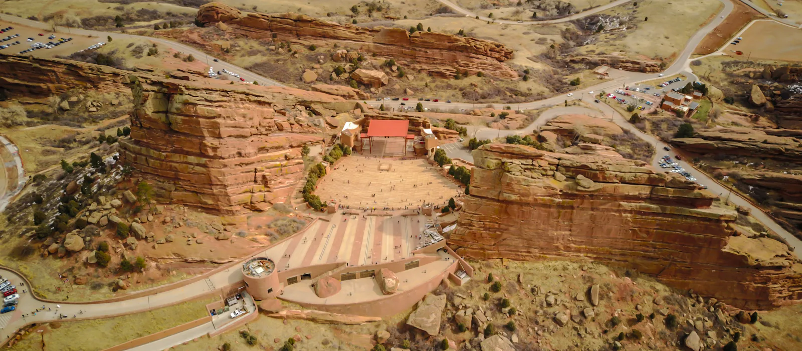 Aerial view of Red Rocks Amphitheatre between tall red sandstone formations near Morrison.