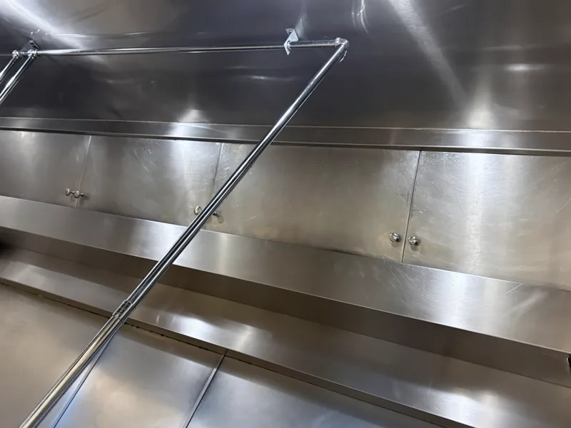 Corporate dining hood plenum after cleaning, polished stainless panels, Centennial.