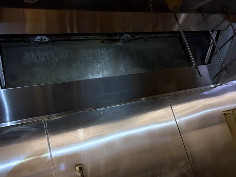 Grocery store hood plenum after cleaning, filter slot and panels clean, Glenwood Springs.