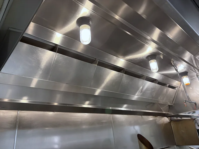 Hotel hood plenum after cleaning, interior panels clean and bright, Denver.
