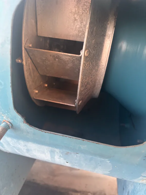 Stadium exhaust fan housing after cleaning, blades and housing wiped clean, Denver.