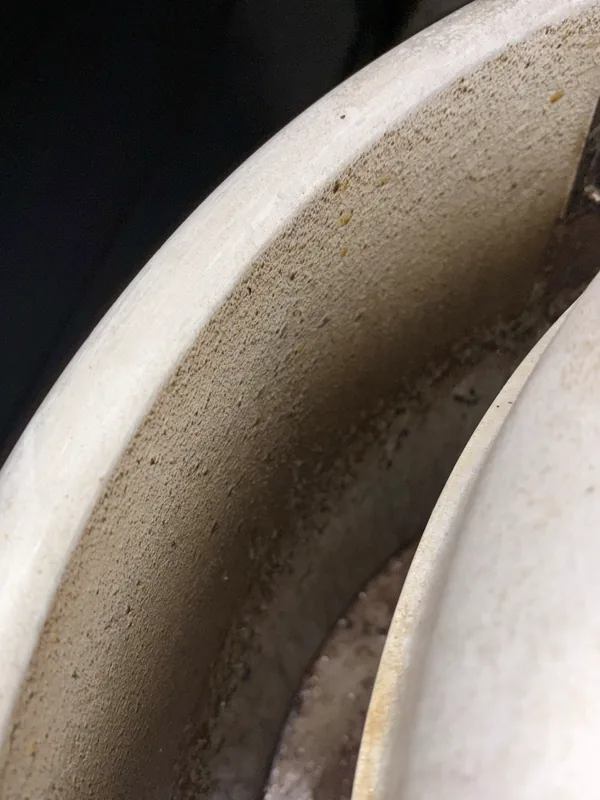 Brewery exhaust fan housing before cleaning, grease film on the curved inner wall, Georgetown.