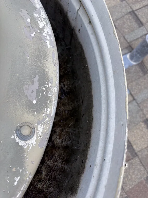 Fire station exhaust fan rim before cleaning, thick grease deposit inside the housing, Thornton.